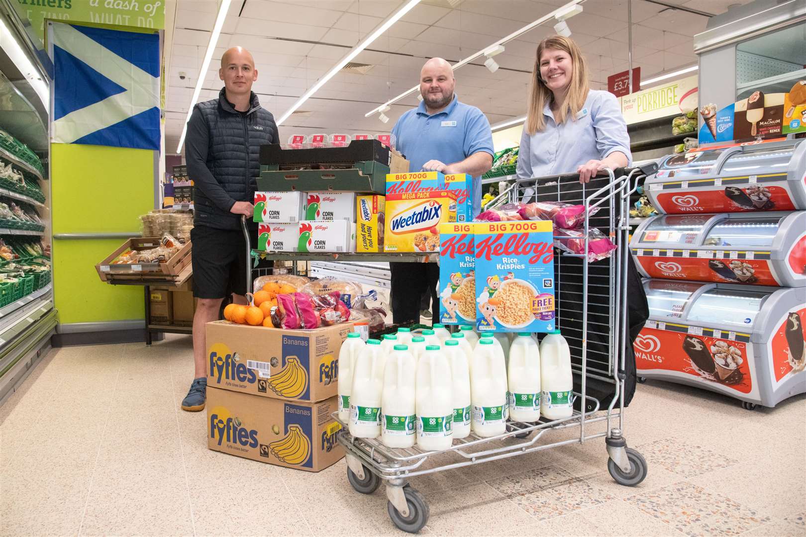 From left; Barry Chambers (Lossiemouth High School PE Teacher), Bob Henderson (Co-op Store Manger) and Lucy Smith (Co-op Team Leader)...The Lossie Co-op has donated all the necessary food for Lossiemouth High School's Big Brain Breakfast...Picture: Daniel Forsyth..