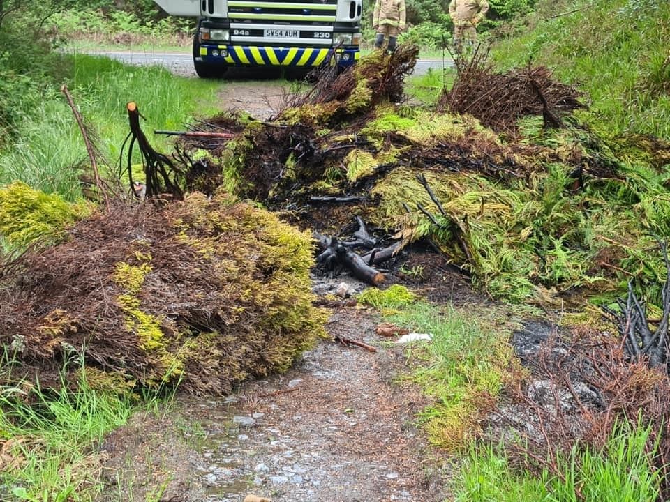 The remains of the pile of dumped conifer cuttings after fireifghters extinguished the fire. Picture: Fochabers fire station