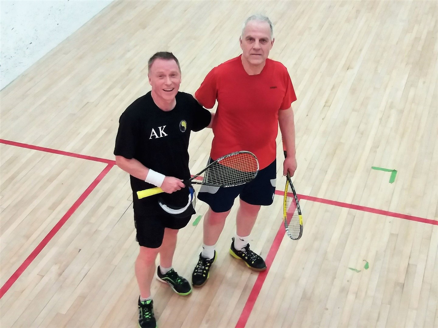 David Taylor (right) after a match in recent times for Forres, has earned a Scottish Services to Squash award after nearly 50 years in his sport.