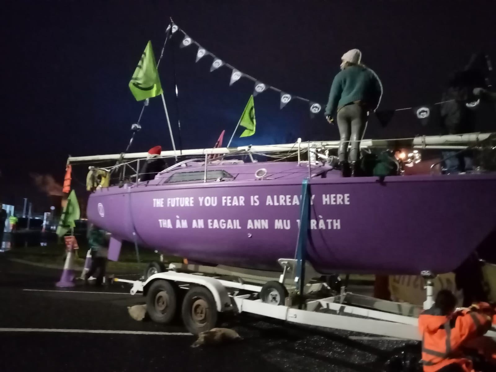 Activists blocking the gates with boats (Extinction Rebellion Scotland/PA)