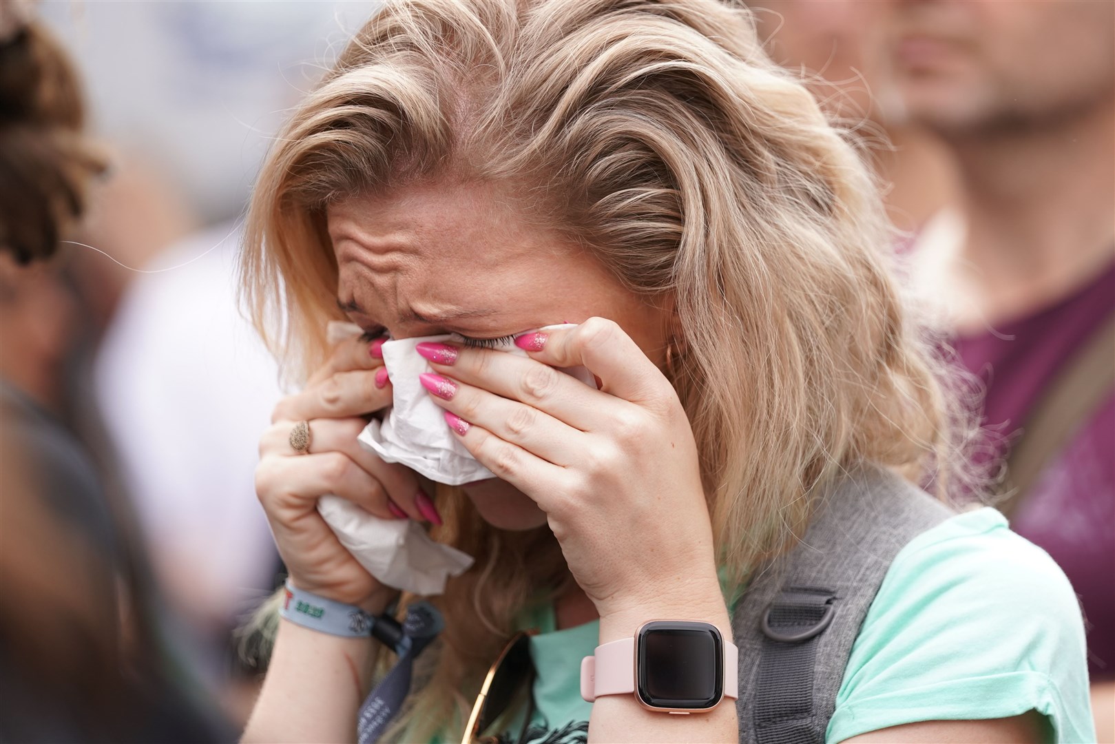 A woman in tears at a climate protest in London (Kirsty O’Connor/PA)