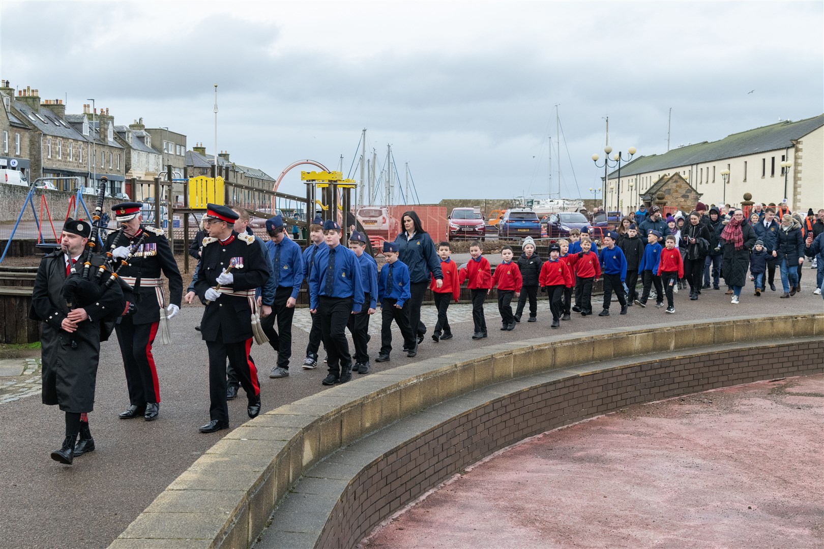Lewis Hogg from Elgin and District Pipe Band pipes Lord-Lieutenant of Moray Seymour Monro and Lord-Lieutenant of Banffshire Andrew Simpson to Station Park...Boys' Brigade 140th anniversary in Lossiemouth...Picture: Beth Taylor.