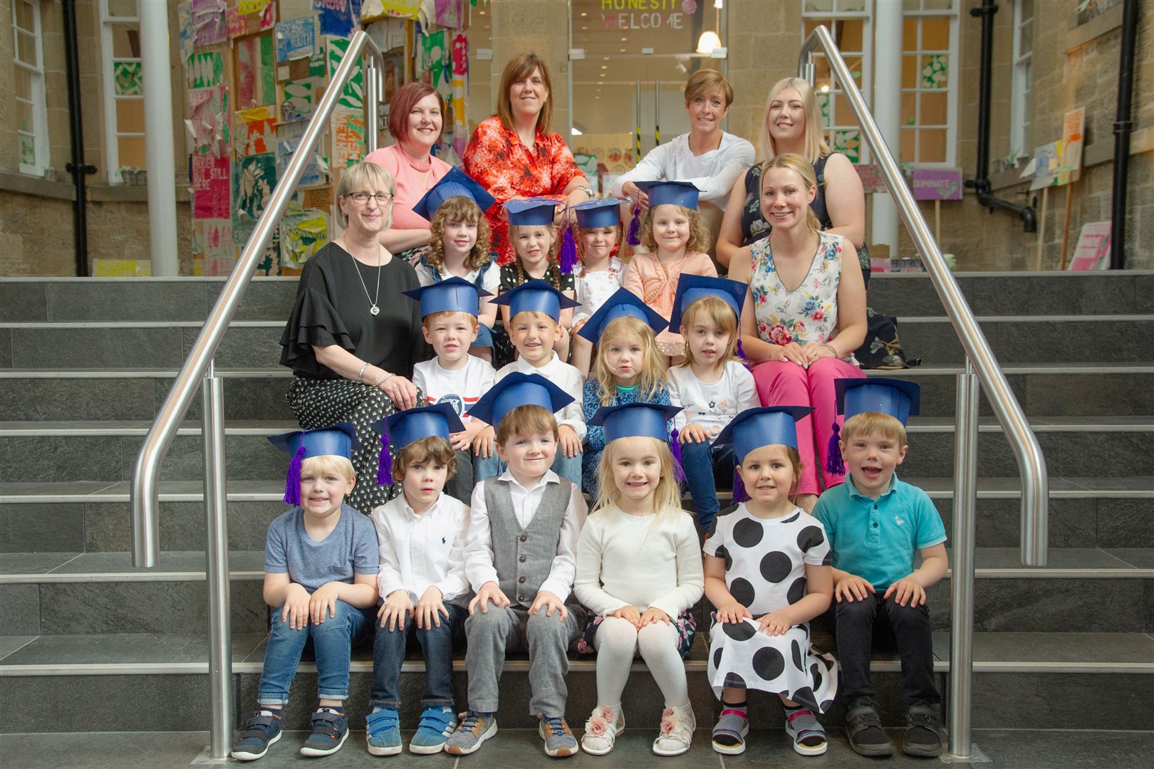 Nursery children at Moray College are joined by staff ahead of their graduation ceremony. Picture: Daniel Forsyth. Image No.044232.