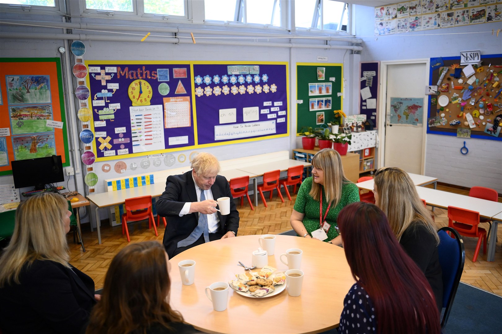 Prime Minister Boris Johnson has a cup of tea with teachers at Field End Infant School (Daniel Leal/PA)