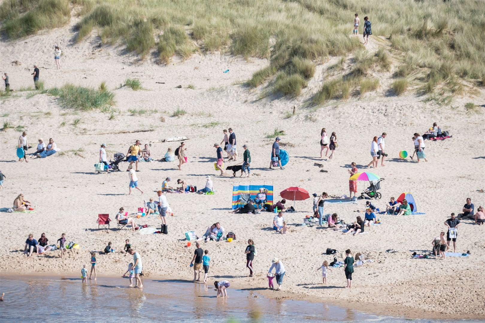The sunshine on Saturday encouraged people to visit the beach and go for a dip in the Moray Firth. Picture: Daniel Forsyth