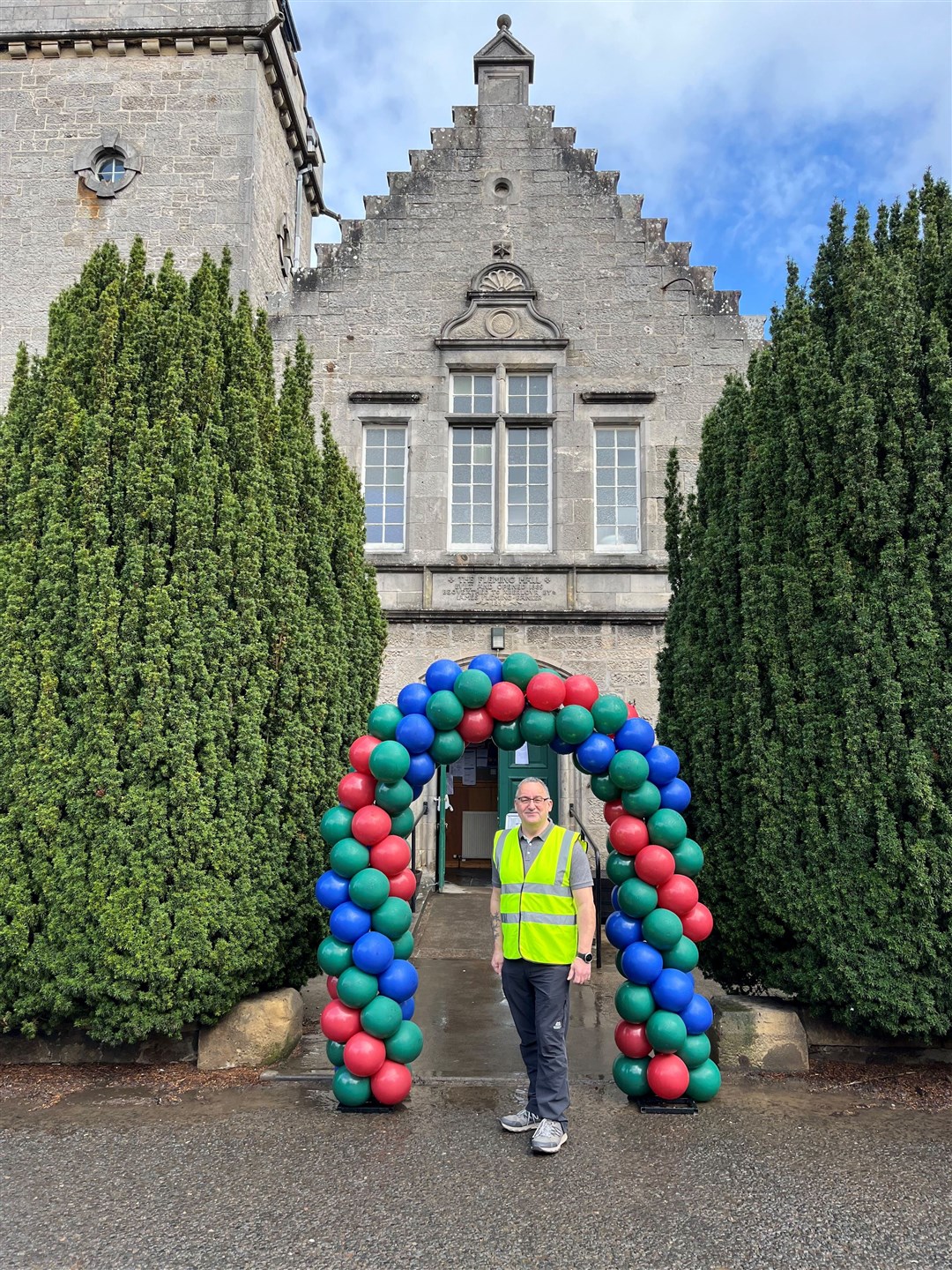 Organiser Vince Stuart of the Aberlour Community Association stands ready to welcome community members into the Fleming Hall.