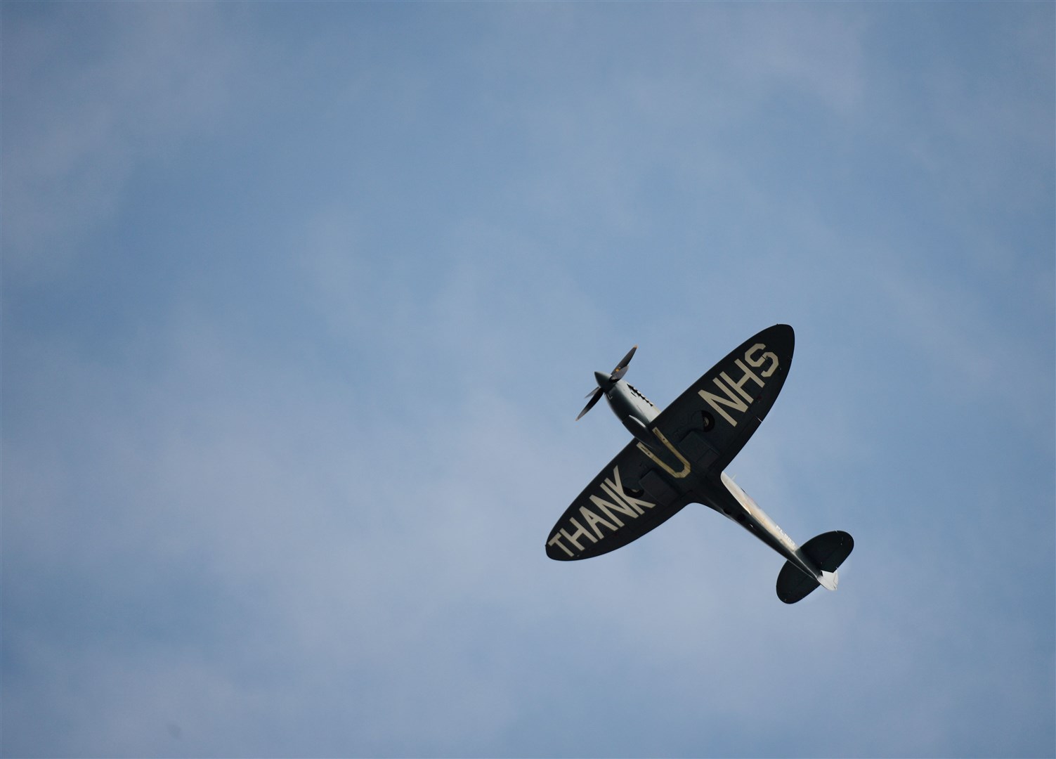 The Spitfire flys over Dr Gray's Hospital. Picture: Daniel Forsyth