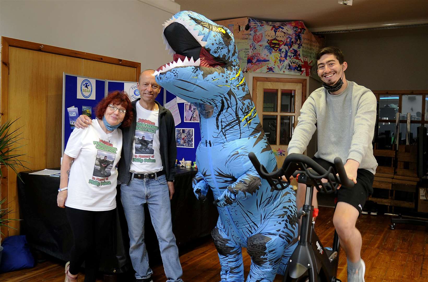Kay and Eddie Polese with Riley Mclaggan, in a dinosaur costume, and youth worker Dan McQuarrie. Picture: Becky Saunderson.