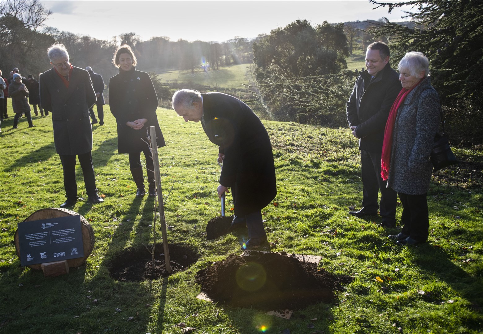 The King plants an oak sapling alongside First Minister of Wales Mark Drakeford, at the National Trust managed estate of Erddig (David Rose/Daily Telegraph)
