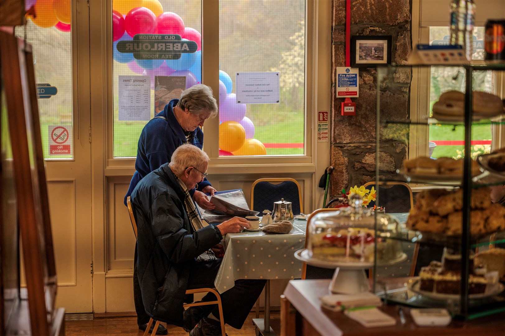 Aberlour residents looking at photos of the damage