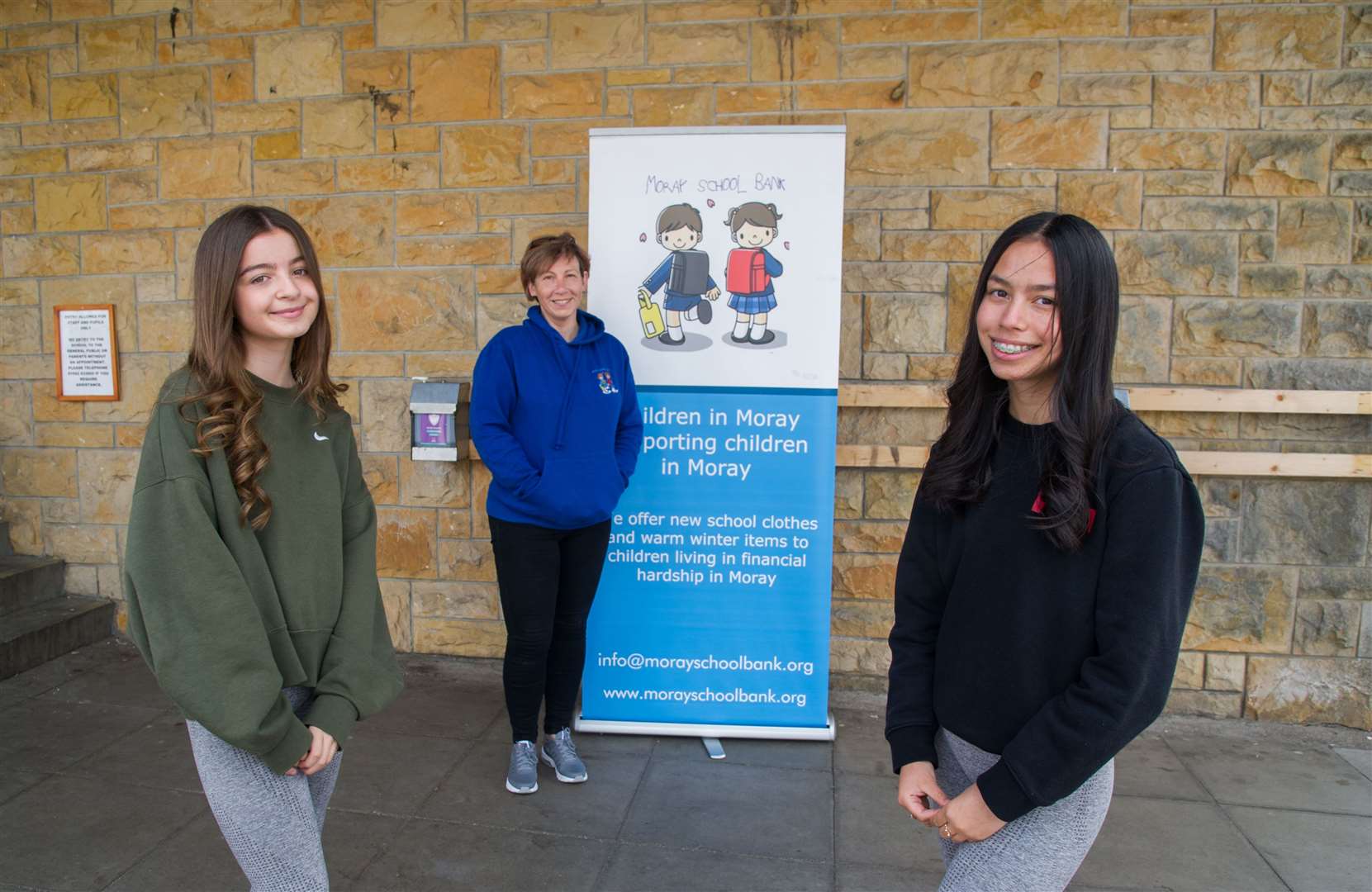 BCHS Youth Philanthropy Initiative winning team Makenna Gauld (left) and Yasmin Mair are congratulated by Debi Kelly from Moray School Bank. Picture: Becky Saunderson