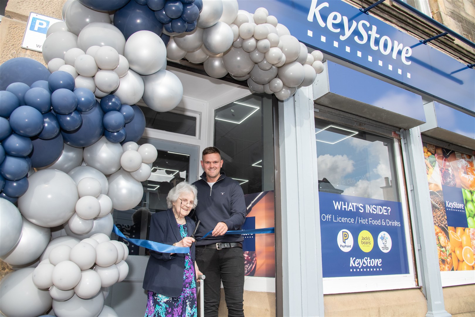 Cathie Longmore cuts the ribbon with Bradley Ogg. ..The Rothes Keystore offically opens after a four month renovation. ..Picture: Daniel Forsyth..