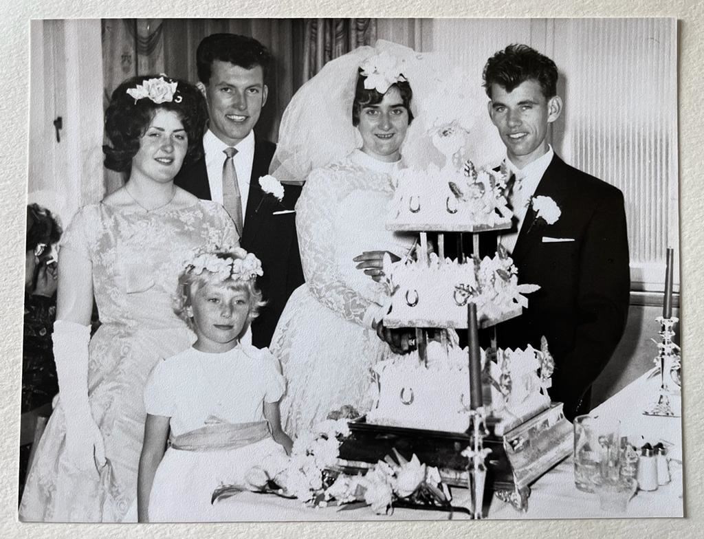 Robert and Mary Dustan cut their cake on their wedding day.