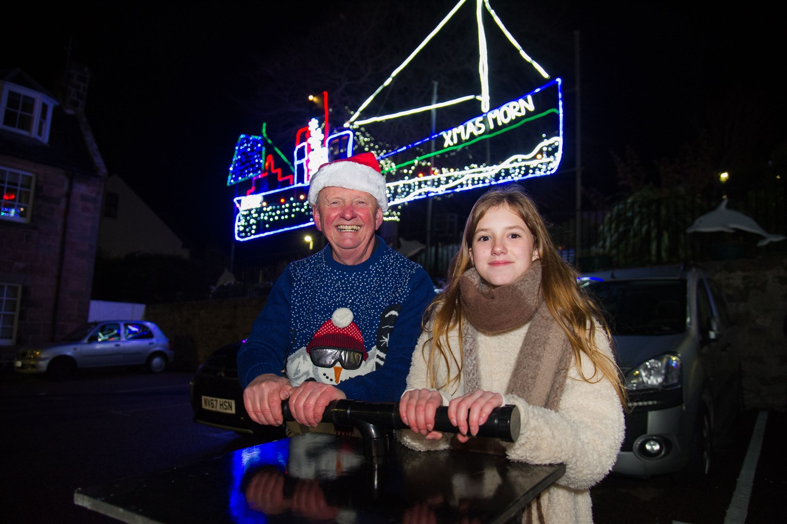 Joni Greer is joined by David Paterson after switching on the lights last year.