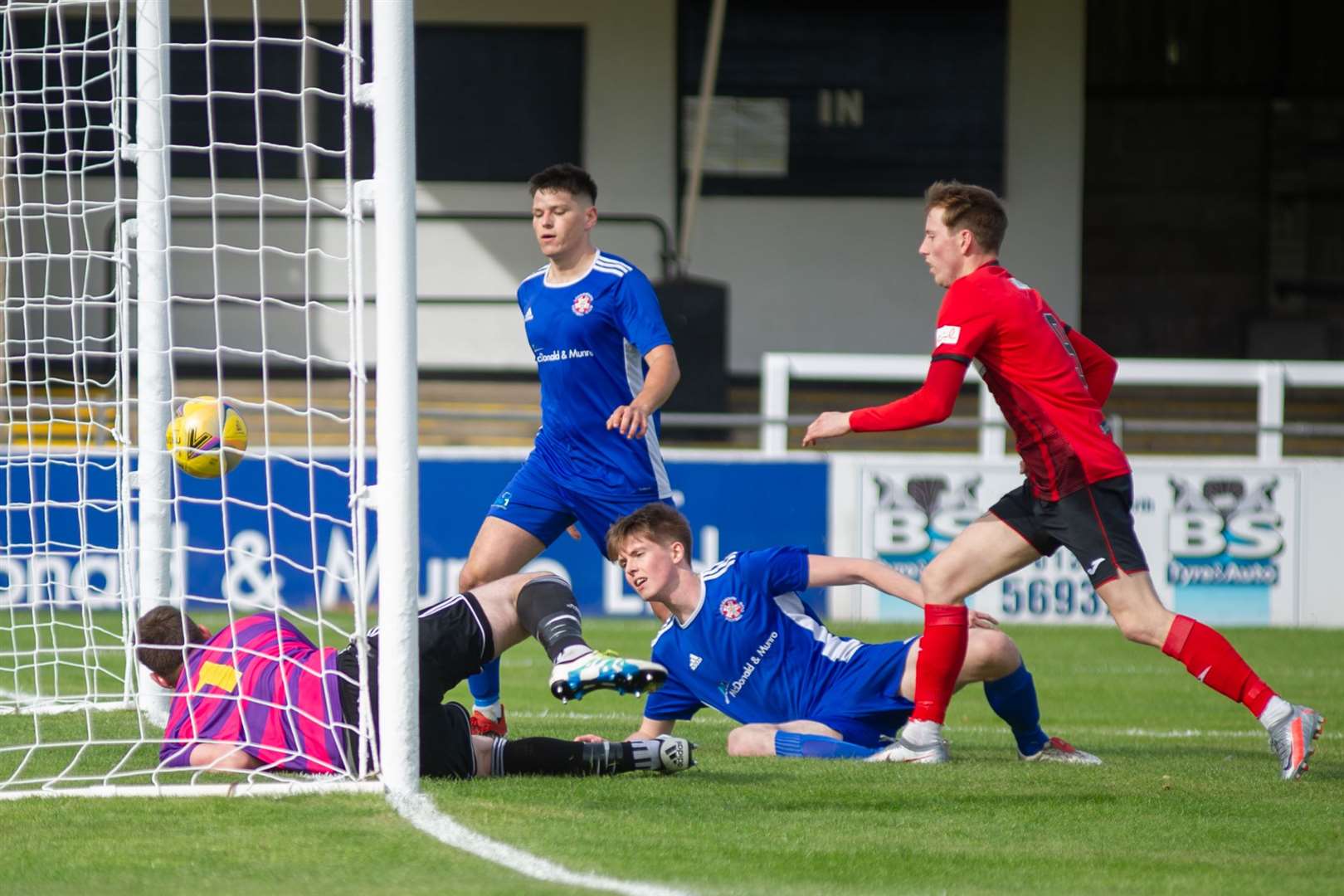 Lossiemouth keeper Stewart Black can't keep out Scott Gordon's own goal. Picture: Daniel Forsyth..