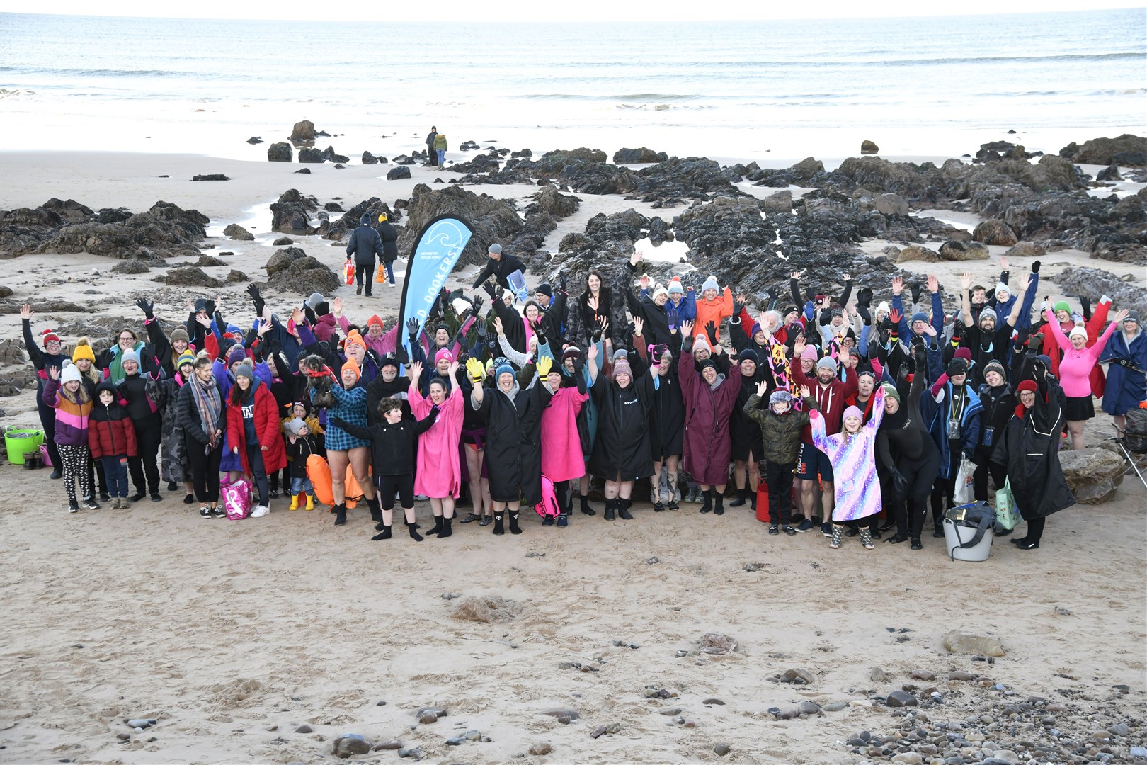 Members take part in the New Year Dook at Cullen Beach. Picture: Beth Taylor
