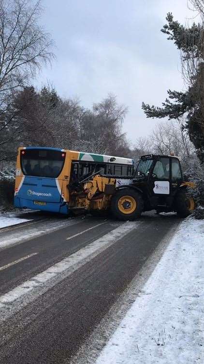 A bus and a forklift have come together on the B9011.