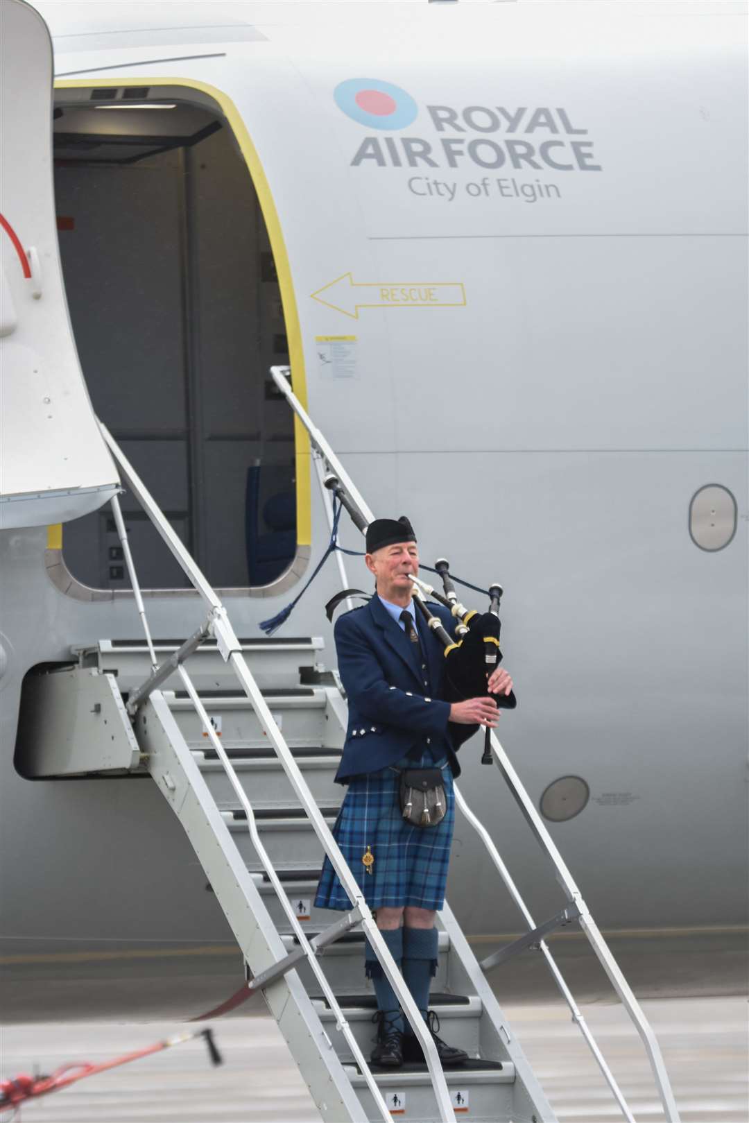 Pipe Major Barry Ashby, RAF Lossiemouth Pipes and Drums, heralds the arrival. Picture: Becky Saunderson.