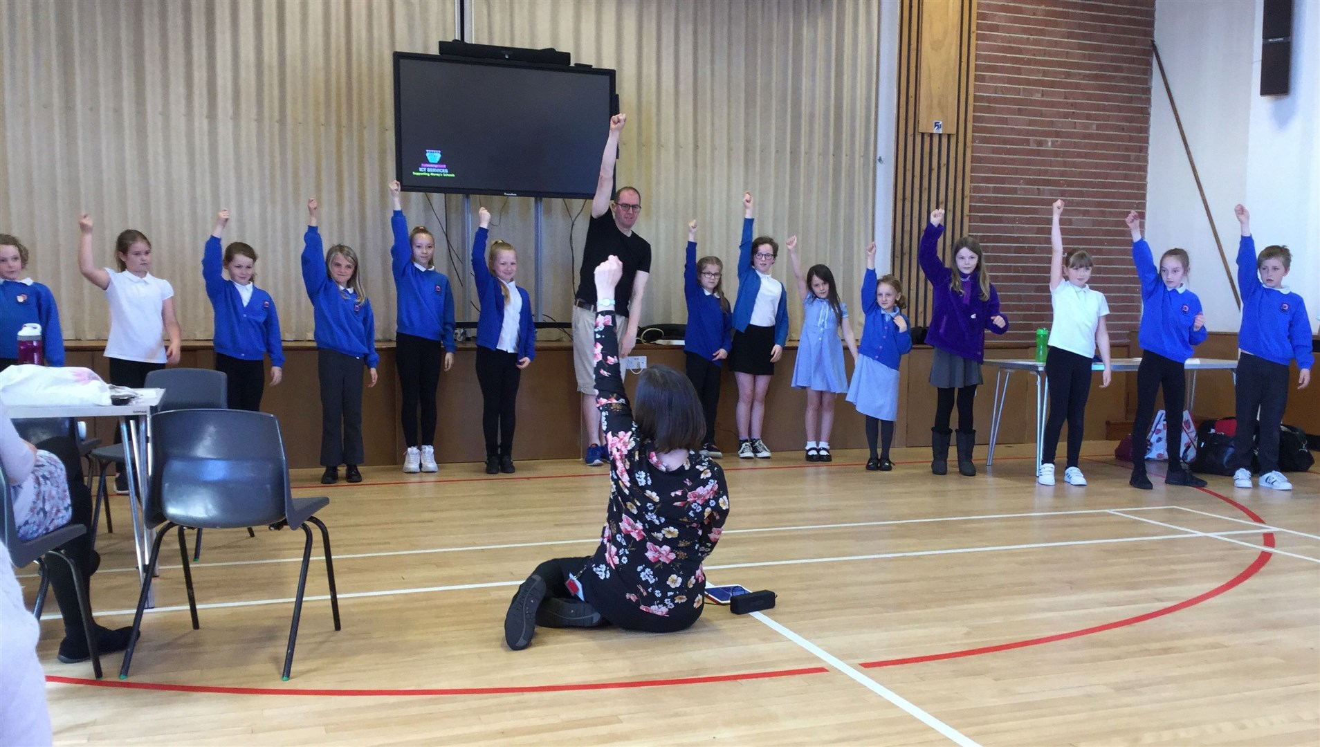 Members of the school's sign language club perform to newly qualified teachers from across Moray.