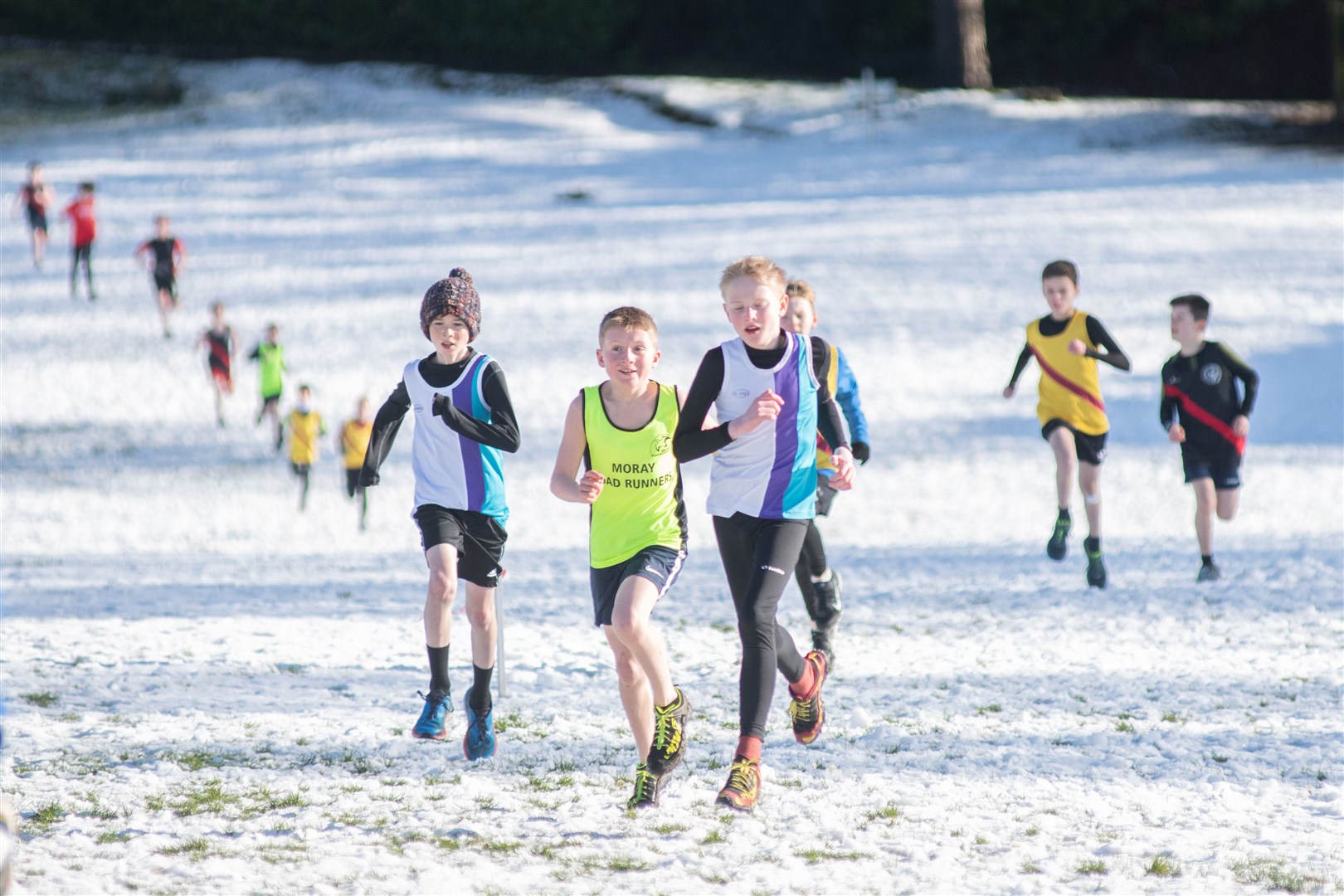 Runners make their way through a snowy Grant Park in the Under 11 Boys race...North District X-Country League - Grant Park, Forres - 19/02/2022...Picture: Daniel Forsyth..