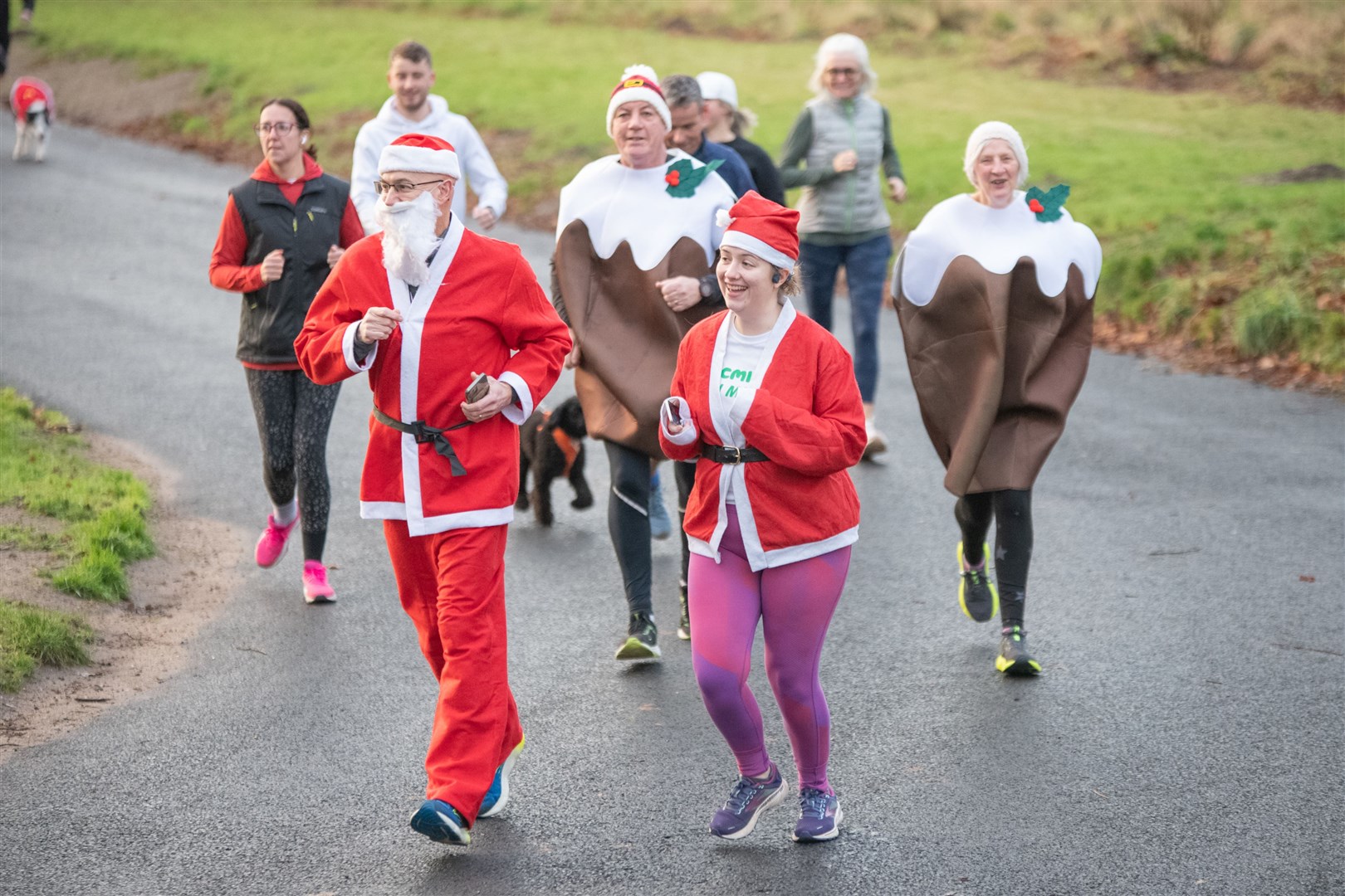 Andy and Amy Kidd took part in the race dressed as a pair of Santas...Elgin Christmas Day parkrun 2023...Picture: Daniel Forsyth..