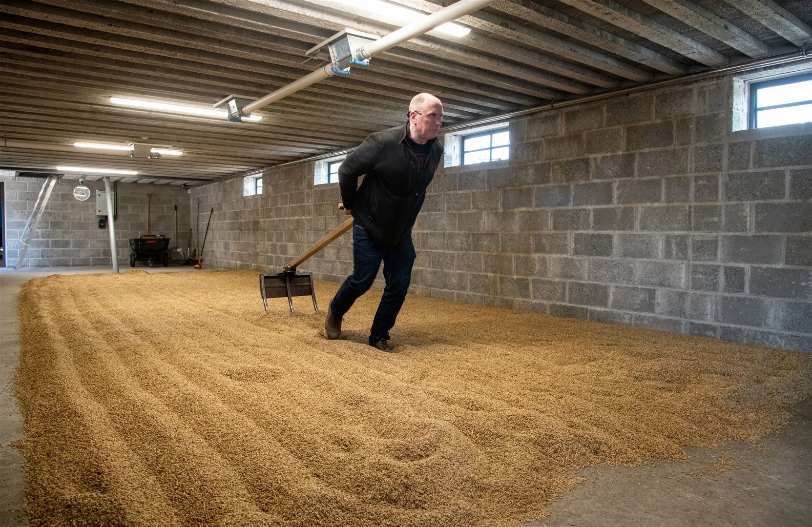 Members of the tour got to try out stages of the whisky making process at Dunphail DistilleryPicture: Daniel Forsyth.