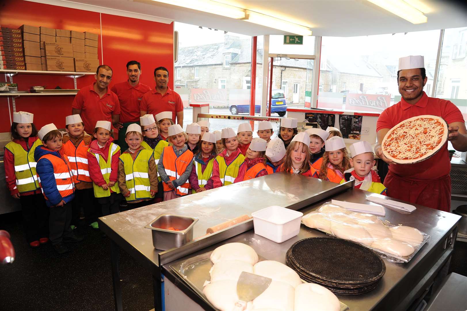 Pino Pizza, pictured here with St Gerardines pupils, have been nominated for the award of best pizza takeaway. Picture: Eric Cormack. Image No.028887.s