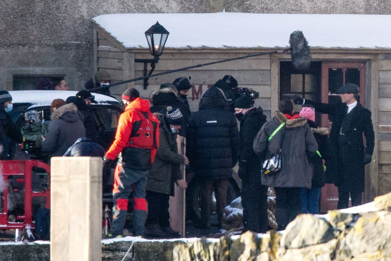 Tommy Shelby - portrayed by Cillian Murphy - aims a gun at Michael Gray during filming...Peaky Blinders filming in Portsoy 10/02/2021...Picture: Daniel Forsyth..
