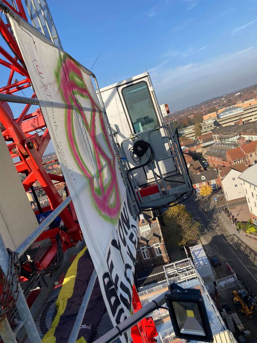 The set-up Alex Sidney made for himself at the top of a crane in Norwich as part of a climate inaction protest (Extinction Rebellion Norwich/PA)