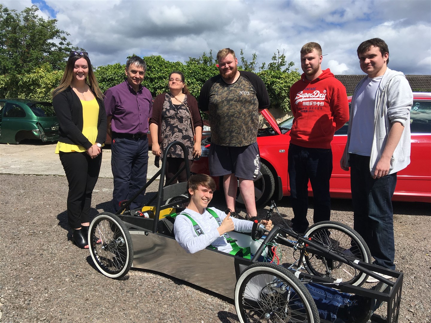 (From left) Aimee Stephen, from DYW Moray, and lecturer Paul Rochford with the Moray College UHI student team involved in building an electric car.