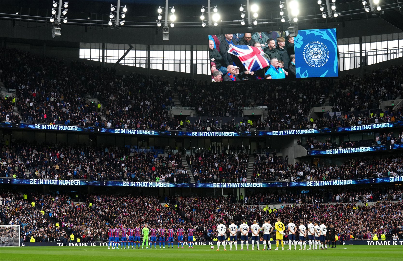 Tottenham Hotspur players stand for the national anthem, to mark the coronation of the King, before their Premier League match against Crystal Palace in London (John Walton/PA)