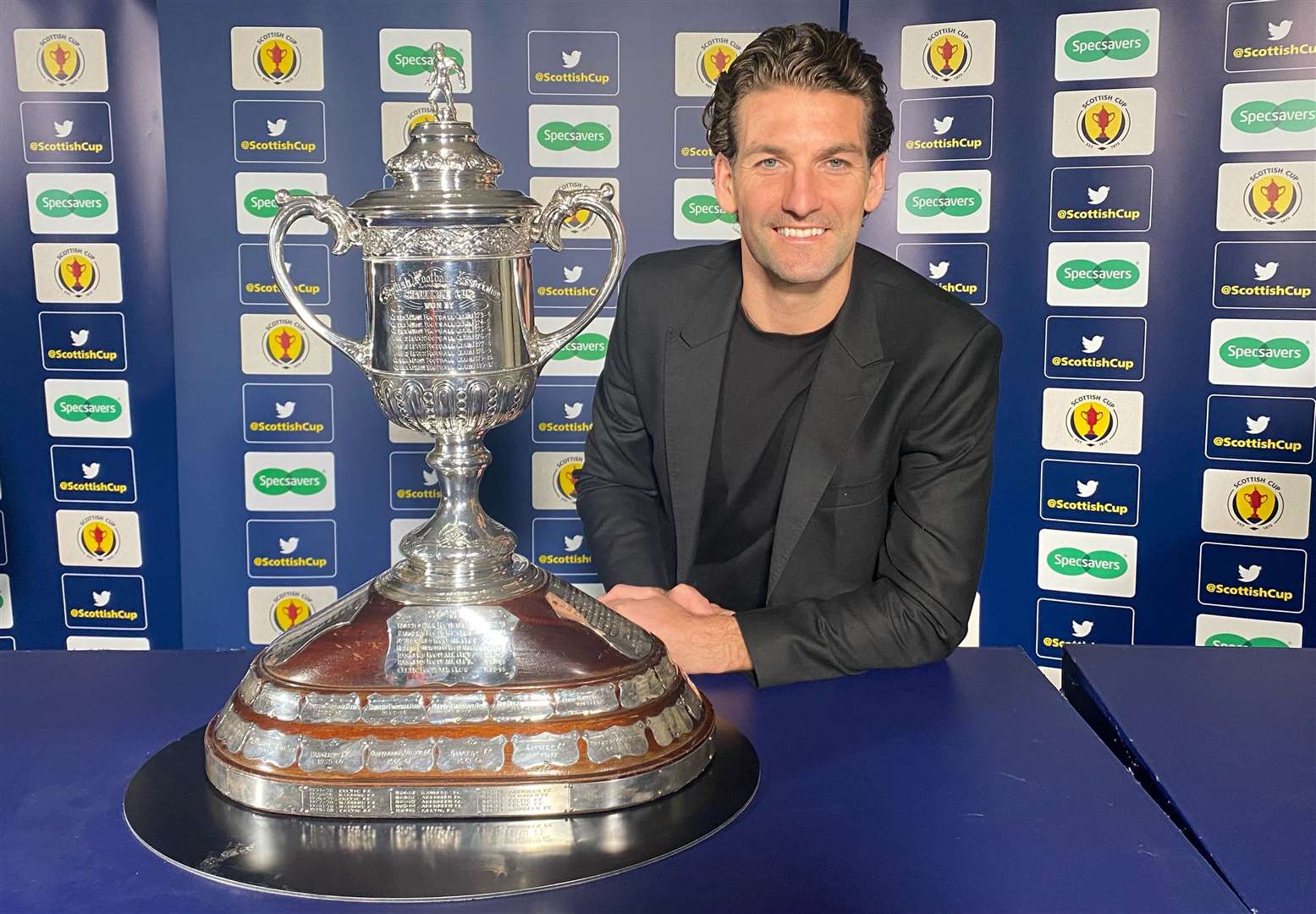Dundee United's Charlie Mulgrew drew the names out of the Scottish Cup third round draw.