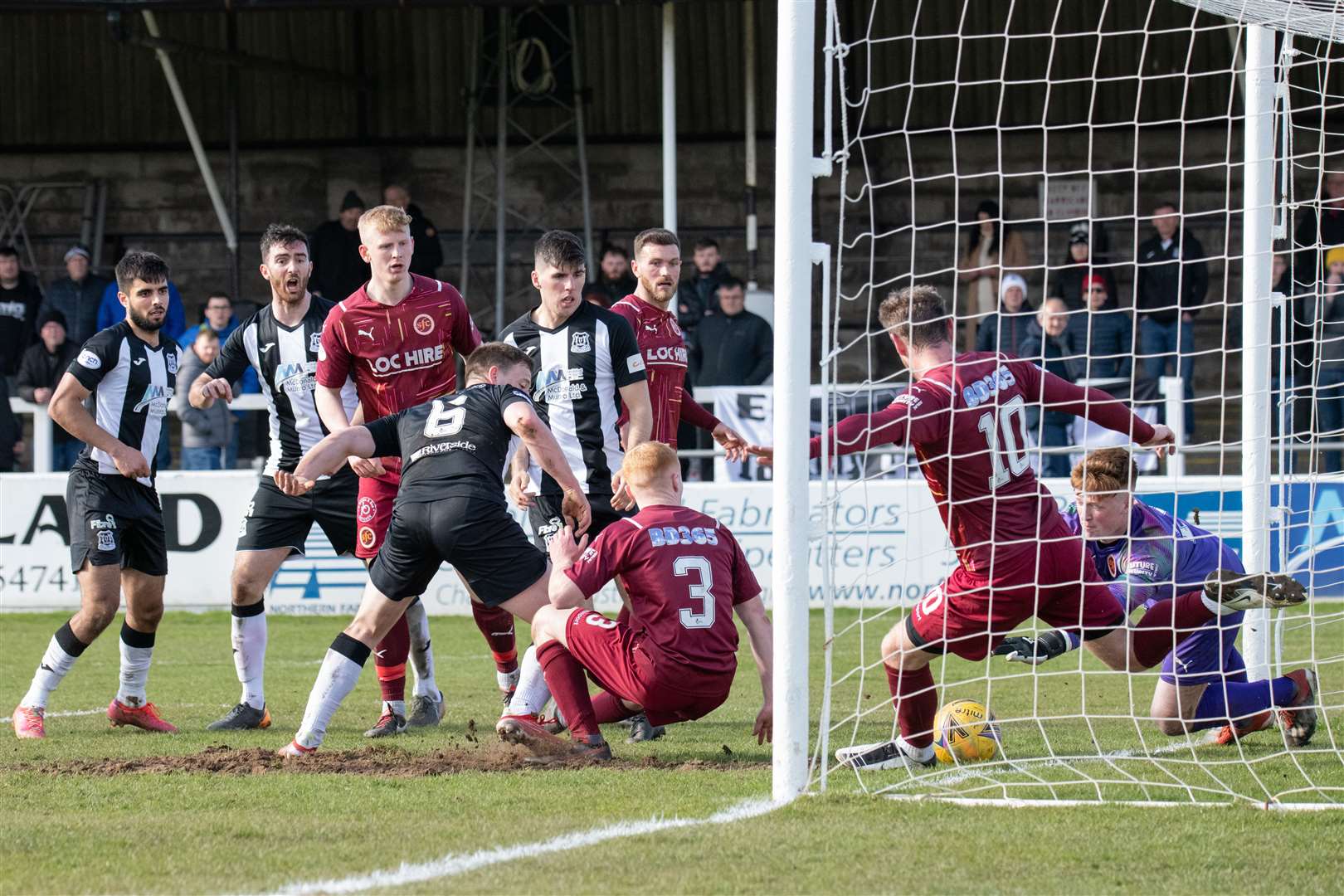 The ball is cleared off the Stenny line by Robert Thomson - the closest Elgin got to a goal all afternoon. Picture: Daniel Forsyth.