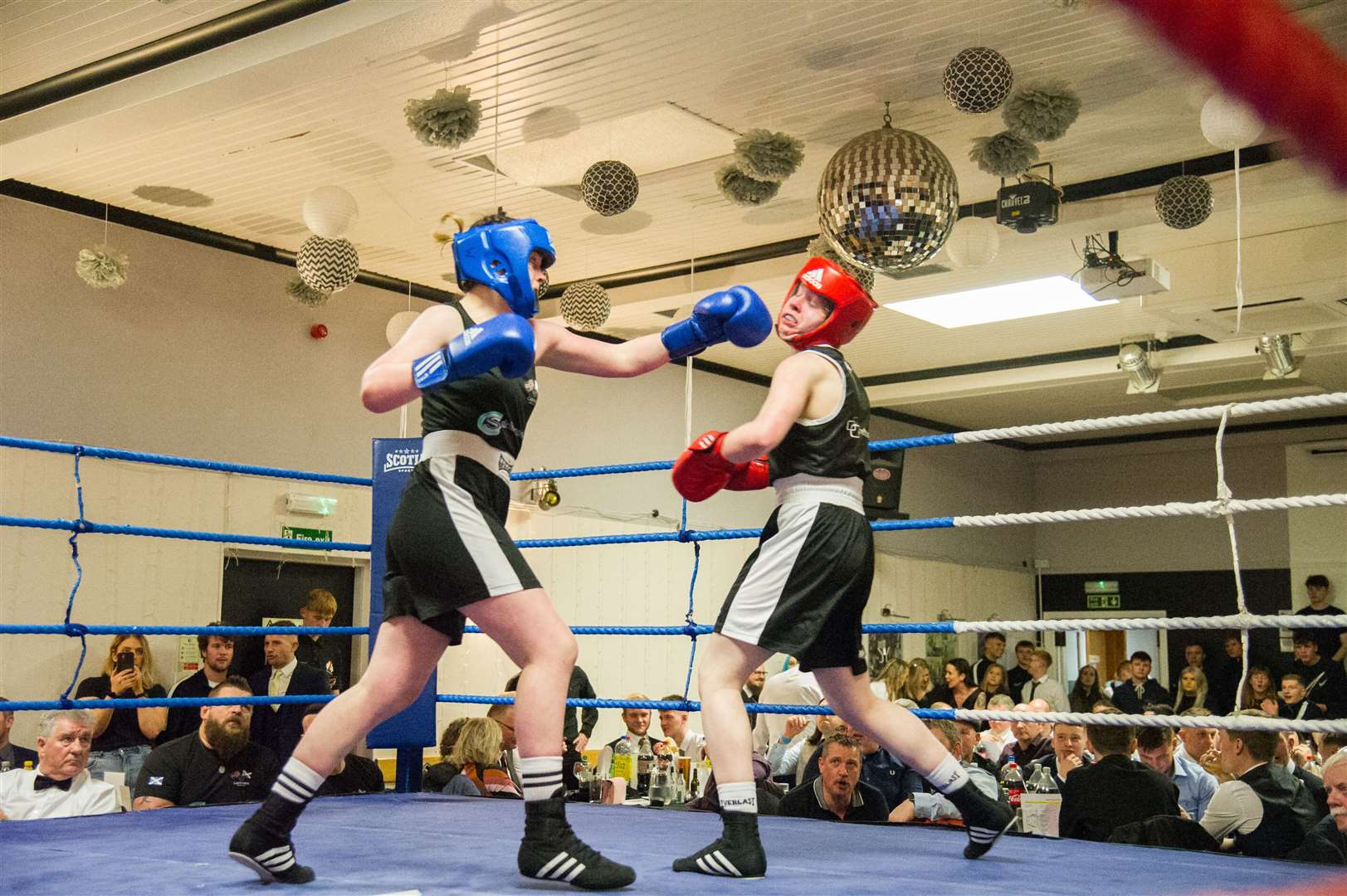 Home boxer Faith Ross (right) fighting against Alisha Mackay (Caithness BC). Picture: Becky Saunderson..