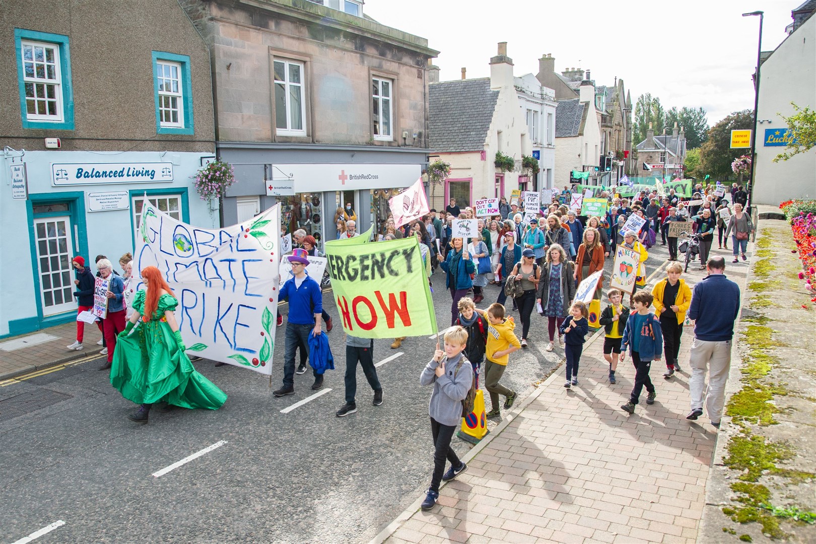 Activists make their way down the High Street in Forres...Forres Earth March - Friday 24th September 2021...Picture: Daniel Forsyth..