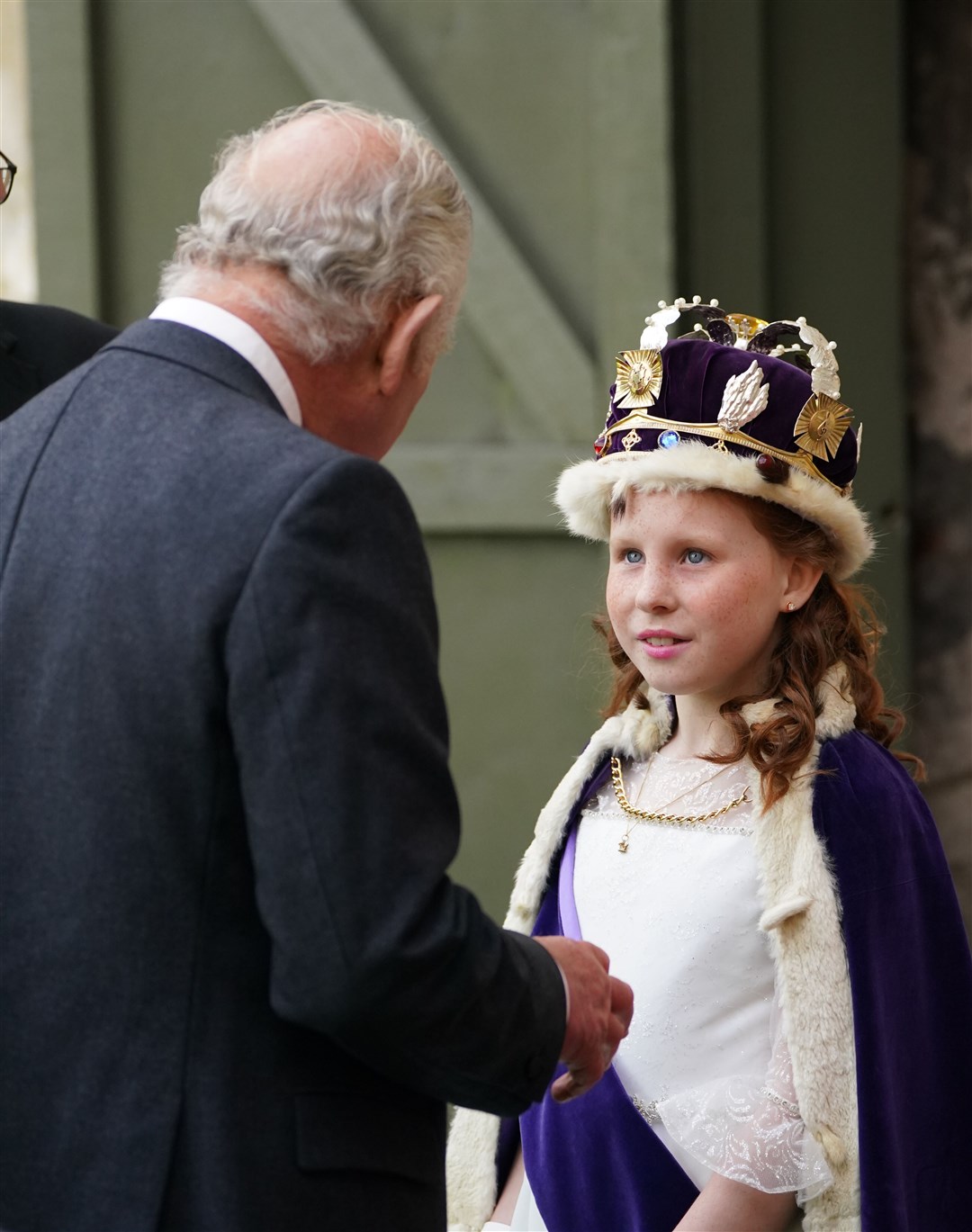 King Charles meets the Bo’ness Fair Queen, Lexi Scotland, during his visit to Kinneil House (Andrew Milligan/PA)