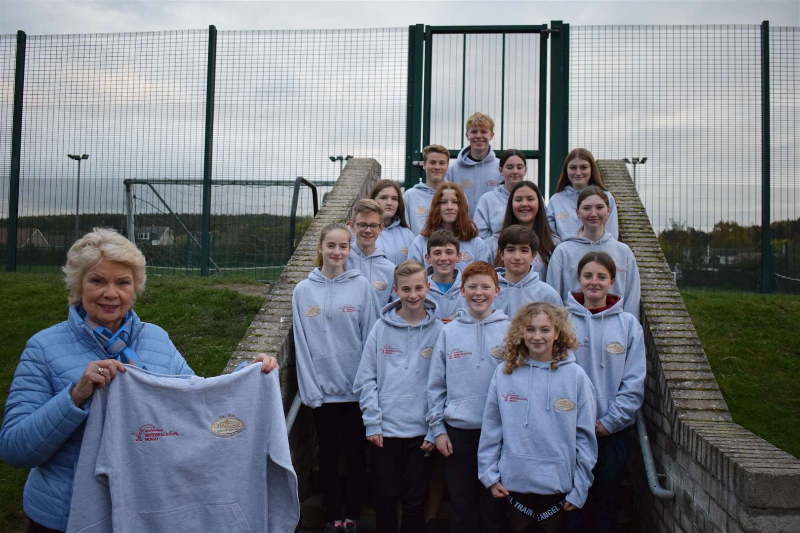 Christine Christine hands over hoodies to the Milne's ASG Young Leaders group on behalf of Christie's of Fochabers. Picture: Active Schools