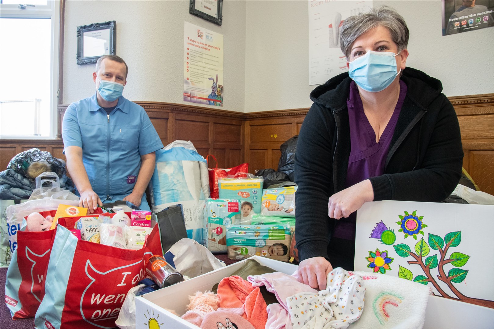 Buckie Dental Practice principal dentist Tad Grygiel (left) and practice manager Jennifer Hay with some of the items donated for Ukrainian refugess. Pictures: Daniel Forsyth