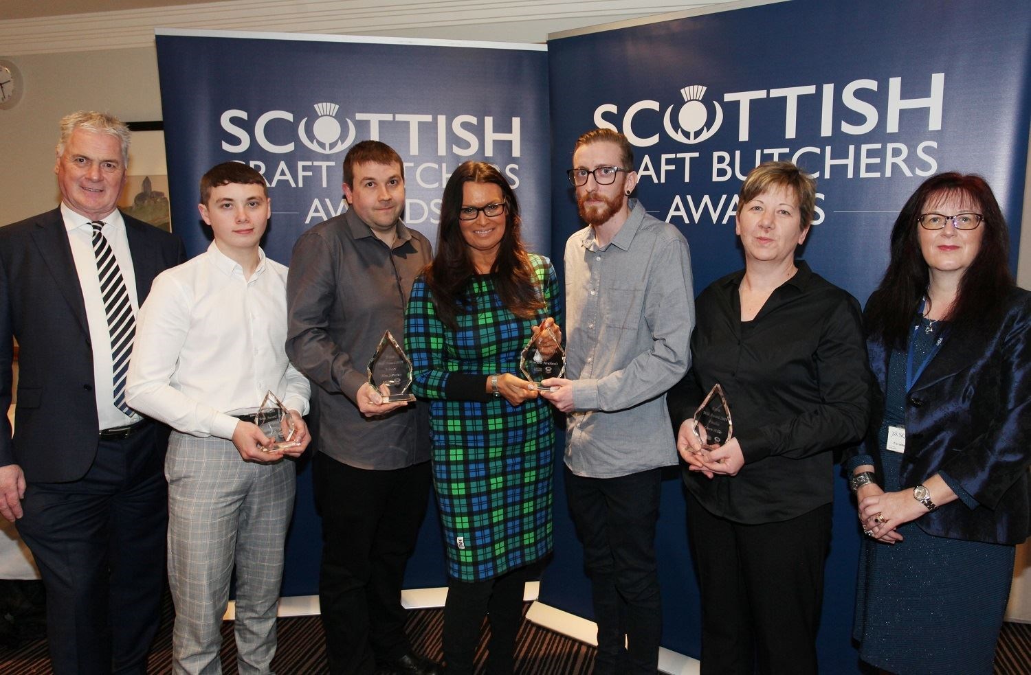 Celebrating at the awards are (from left) Quality Meat Scotland chief executive Alan Clarke; finalist Spencer Hughes; joint winner Alan Jamieson; host Judith Ralston; joint winner Matthew Newlands; finalist Gwen Miller and the Scottish Qualifications Authority's regional manager for Tayside and Fife, Geraldine Balfour.