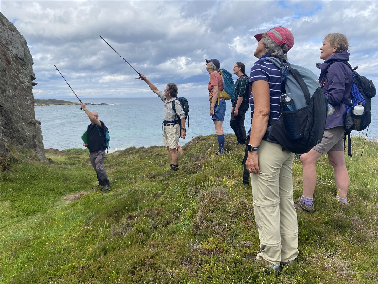 Historian John Barrett leading a cliff-side walk exploring Moray's Pictish past.