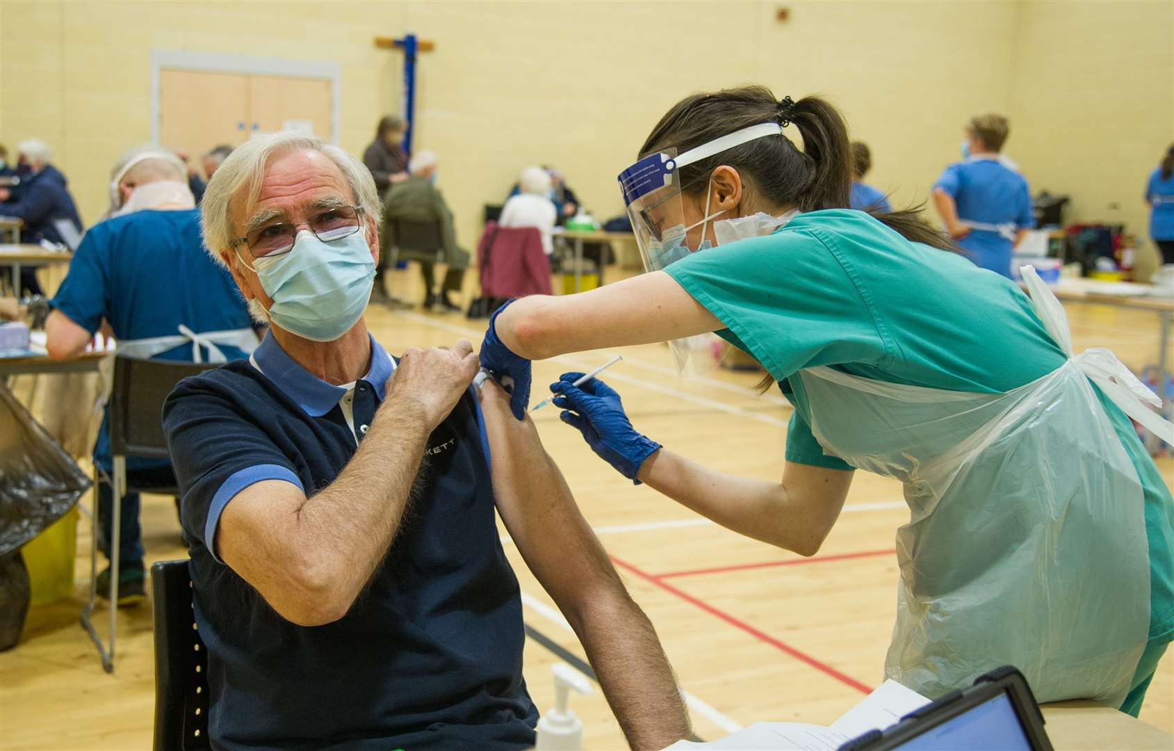 Birthday jab for Dennis Innes as he receives his Covid 19 vaccine from final year medical student Tiffany Martin. Picture: Becky Saunderson