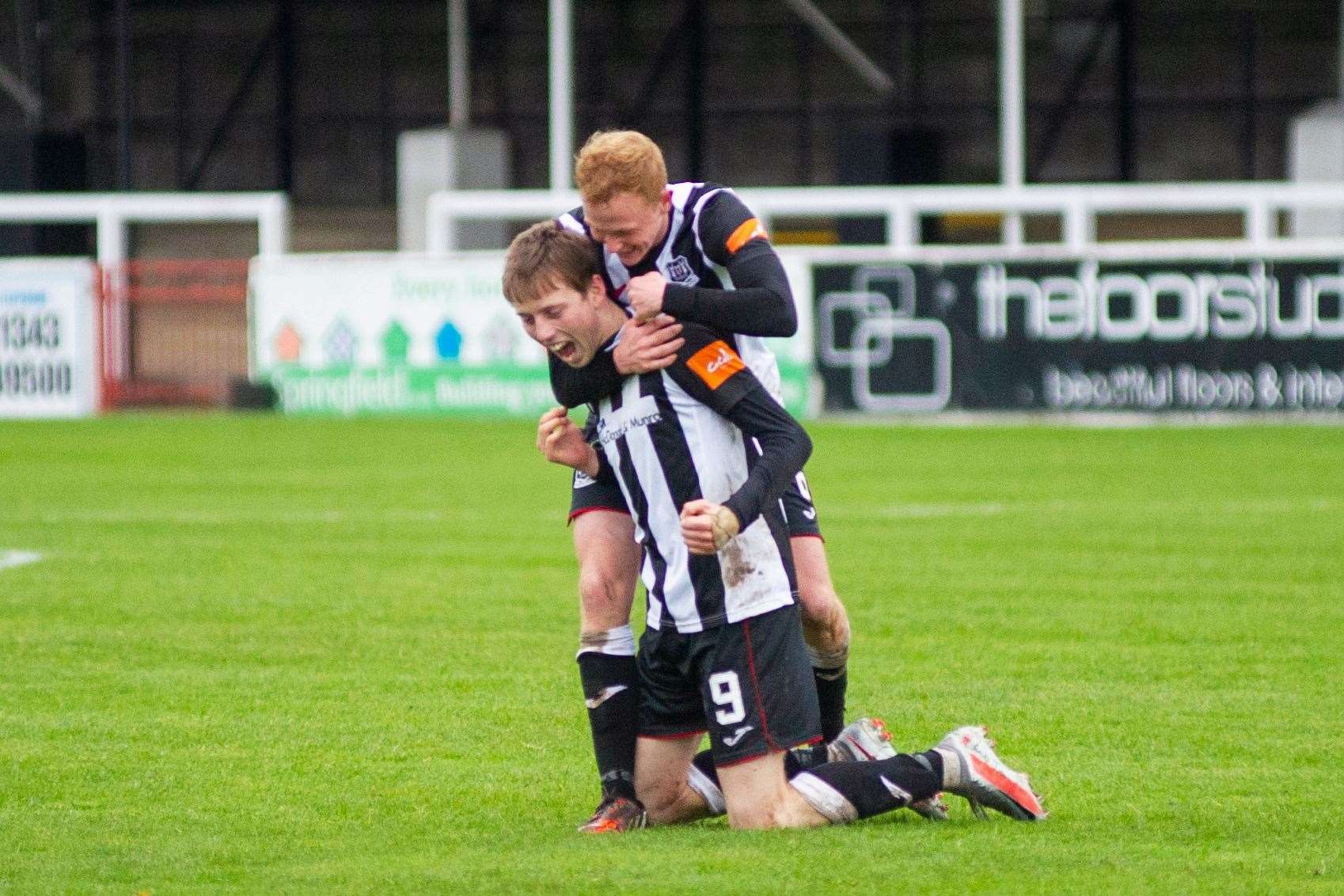 Russell Dingwall celebrates an Elgin goal with the kneeling Kane Hester.Picture: Daniel Forsyth