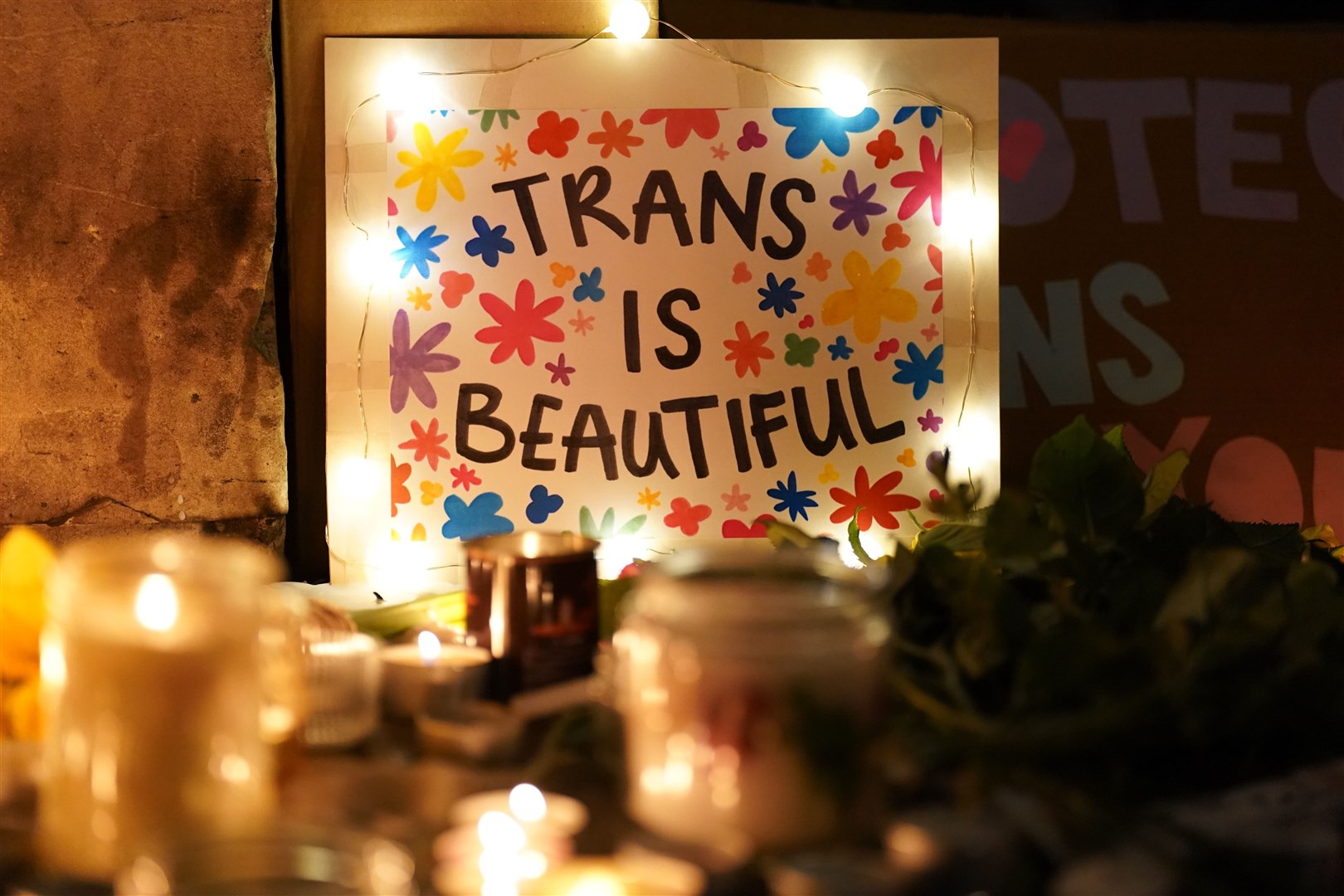 Candles and a sign were placed outside the Department for Education in London as members of the public attended a candlelit vigil in memory of transgender teenager Brianna Ghey (Kirsty O’Connor/PA)