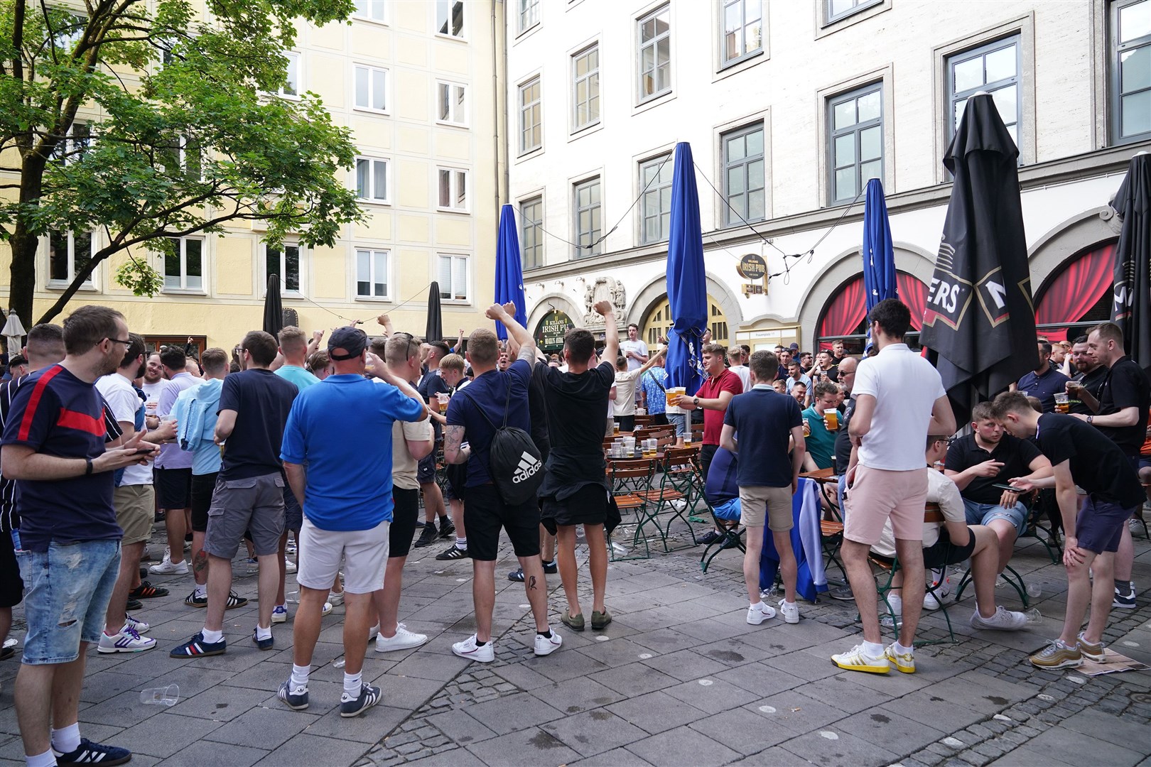 England football fans singing about striker Harry Kane outside Kilians Irish Pub in Frauenplatz square in Munich (Yui Mok/PA)