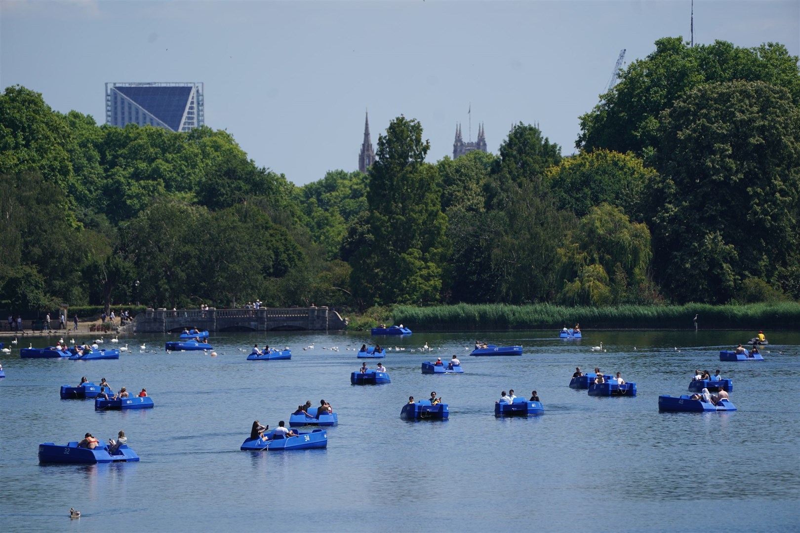 People in pedalos on the Serpentine, Hyde Park, London (Kirsty O’Connor/PA)