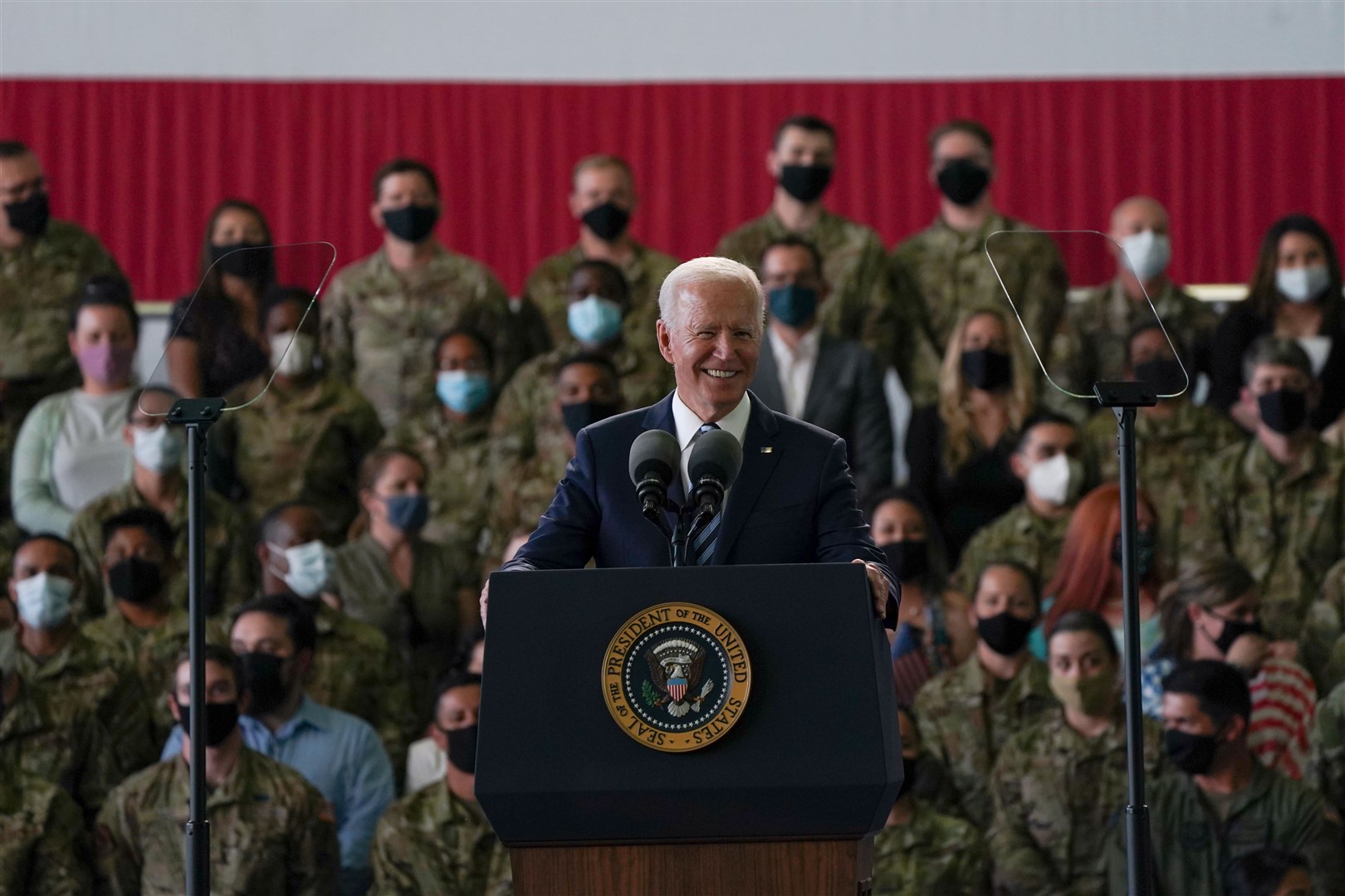 US president Joe Biden addresses US Air Force personnel at RAF Mildenhall (Joe Giddens/PA)