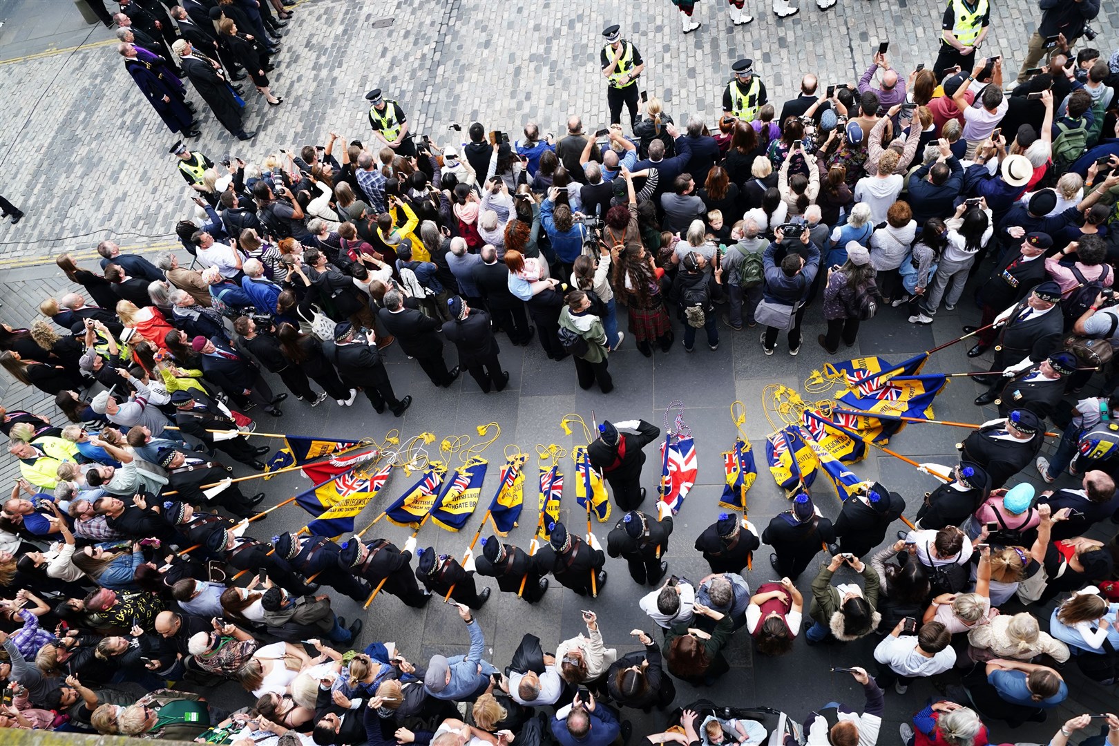 Members of the public are seen during the ceremony (Jane Barlow/PA)