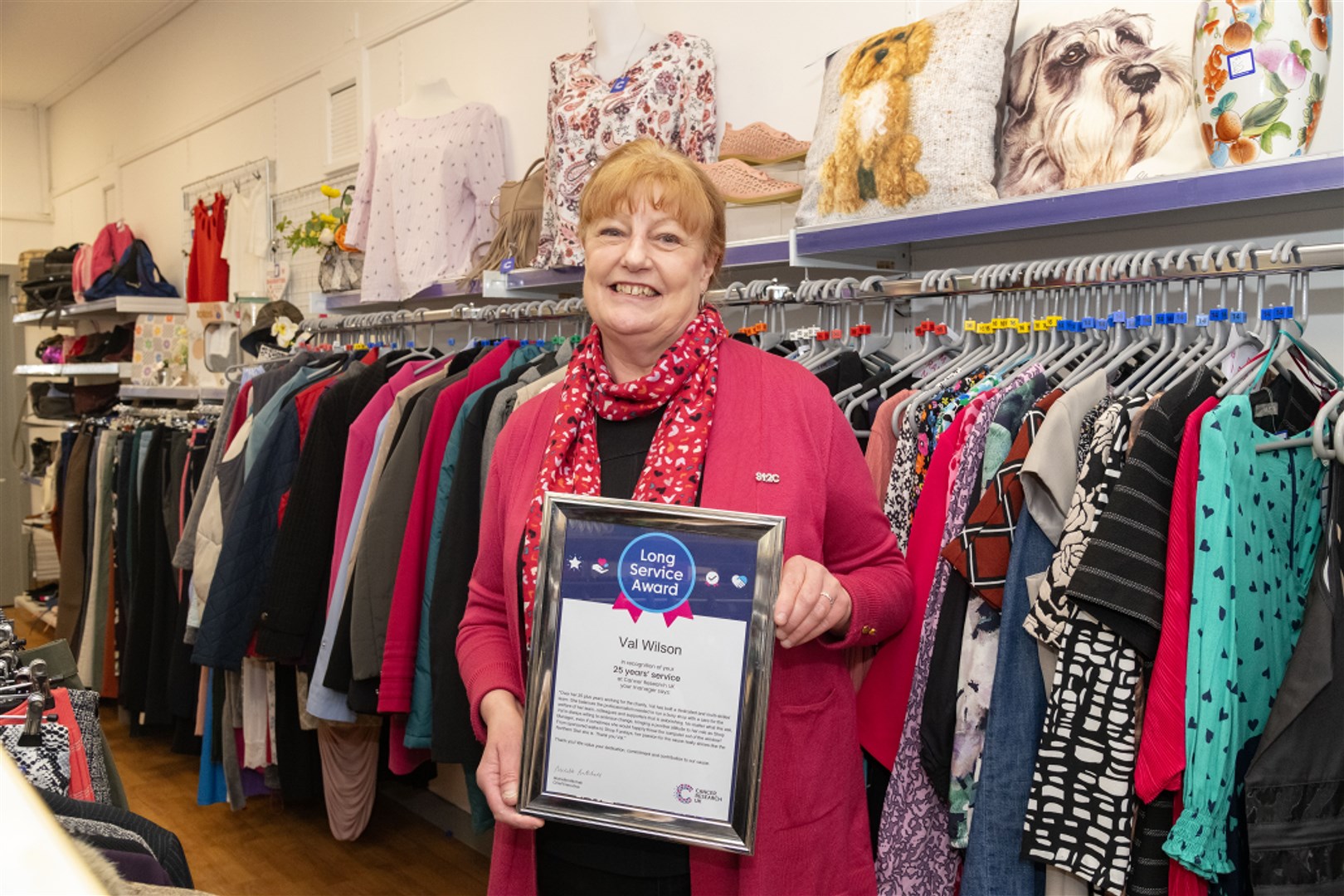 Val Wilson inside the Cancer Research UK shop on Elgin High Street. Picture: Beth Taylor