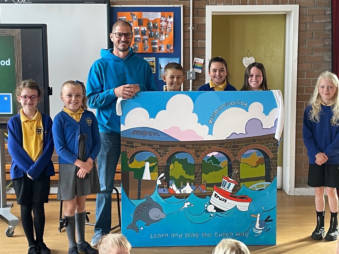 Artists Rob Greenwood with some of the pupils who contributed. Picture:Cullen Primary