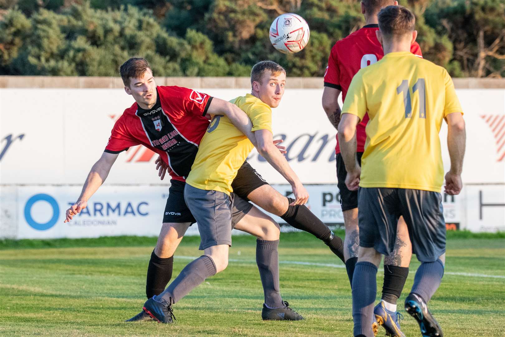 Hopeman's Ryan Fiske tries to twist his way up the park. ..Fochabers FC (7) vs Hopeman FC (2) - Mike Simpson Cup Final 2023 - Grant Park, Lossiemouth...Picture: Daniel Forsyth..